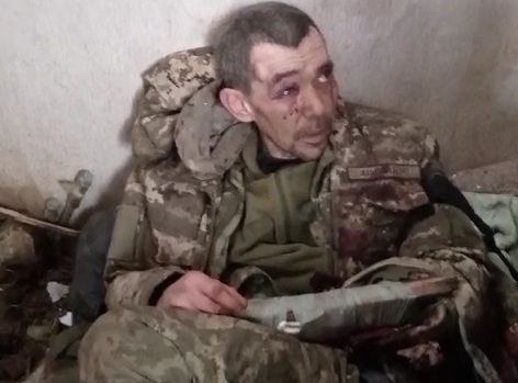 Ukrainian soldier captured in house full of dead bodies 