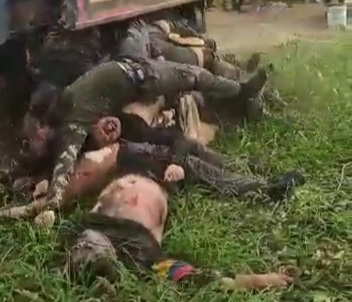 Killed Colombian soldiers transported in back of truck like garbage 