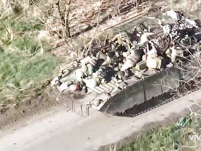 ROLLING BMP WITH DEAD RUSSIAN SOLDIERS ABOARD AFTER DRONE HIT