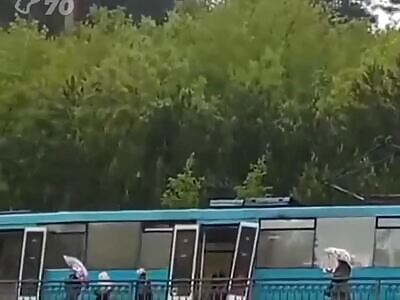 Two russian  thrown  from speeding tram