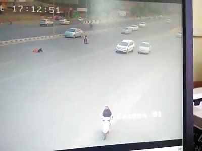 Two Girls Hit by a Speeding Car While Trying to Cross a Busy Highway