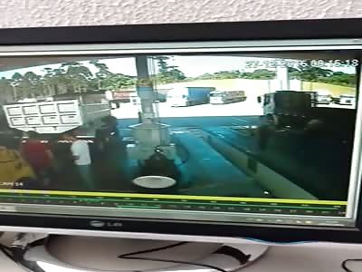 Fatal Error. Man Crushed Between Two Trucks Inside Gas Station