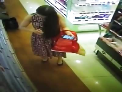 Pretty Woman Apply Body Spray on Her Crotch Inside the Shop