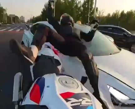 Biker Crashed hard by Stupid Female Chinese Driver 