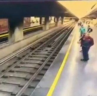 Old Man Patiently Waits To Jump In Front of Tram in Caracas
