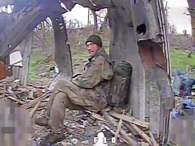 Russian Soldier sits and waits for Ukrainian Drone to get him