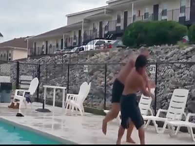 Big Bully Tries To Throw Little Kid Into Pool, Gets Butt Kicked