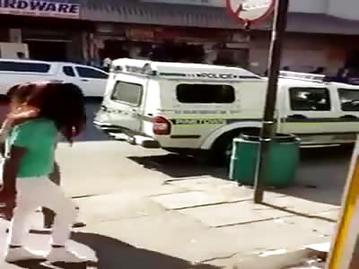 Suspects Escape From A Police Van right Out of the Back in Broad Daylight