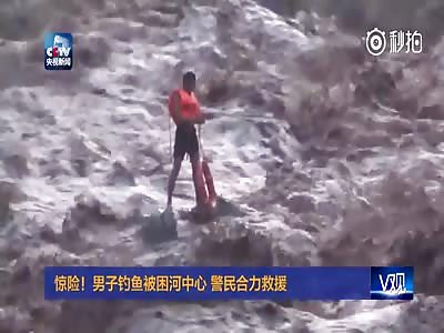 man trapped in the center of the river
