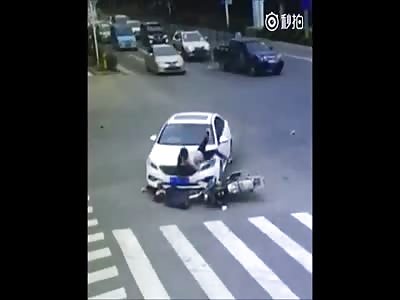 Couple on the bike smashed by car  