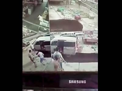 COUPLE FALL INTO SINKHOLE WHEN ROAD COLLAPSES IN CHINA