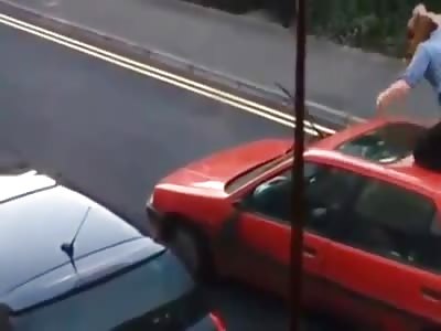 Video shows woman attacking, jumping on car before it drives off with her on the roof, UK