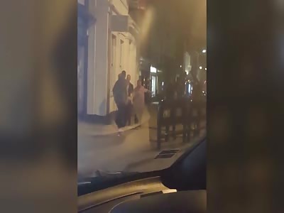 Violent thug punches woman in the face in street brawl