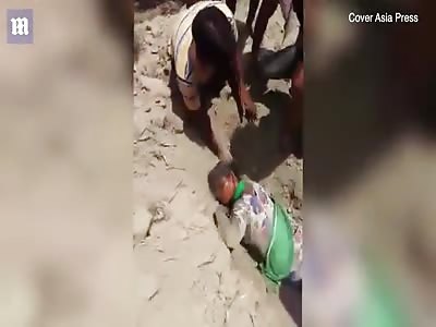 girl is rescued after being BURIED ALIVE for two hours  