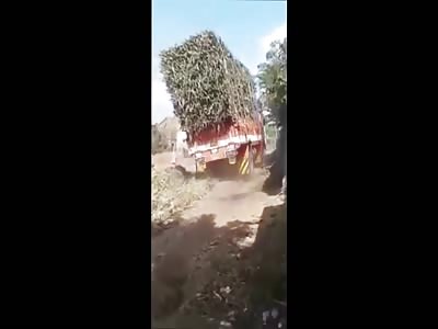Seriously Overloaded Truck Tips Over