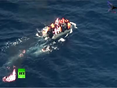 Moment migrant boat bursts into flames in Mediterranean