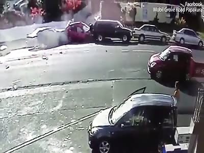 The terrifying moment a speeding car mounts the curb and smashes through wheelie bins
