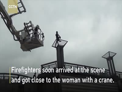 Firefighters save woman trying to jump off bridge