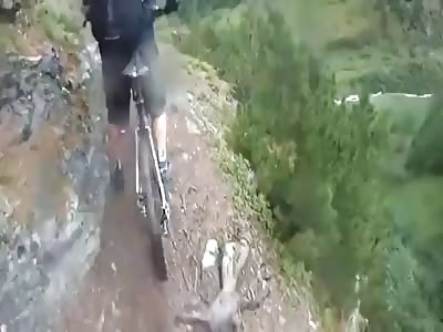 Horrifying Moment Biker Loses His Balance & Falls Off A Cliff!  