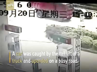 Truck's tail lift catapults car into midair