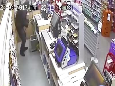 Robber caught on CCTV raiding a Spar shop