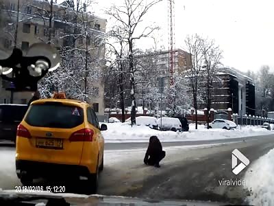 Taxi bumps woman off icy road