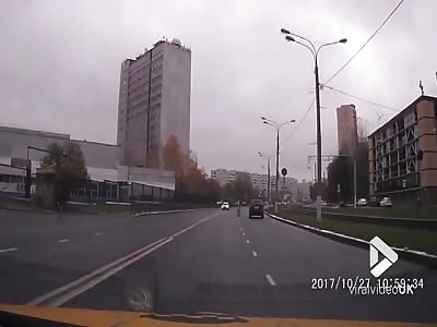 Crazy woman on motorway kicking cars