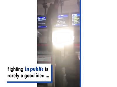 Woman screams bloody murder at her boyfriend atop a ticket machine