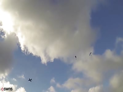 Royal Navy Hawk narrowly misses paragliders