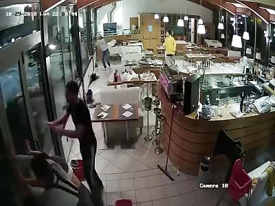 Wave Crashes Through Windows of Italian Restaurant