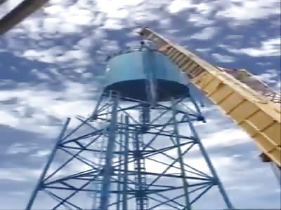 Two Dead After Crane Massively Fails Disassembling A Water Tower