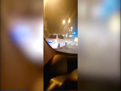 Speeding car crashes into a stationary taxi and almost overturns