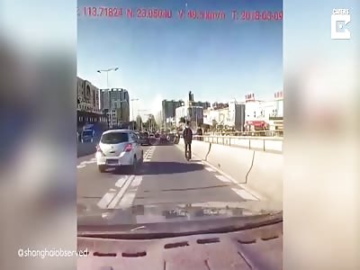 Driver Captures Moment Man Falls Off Segway On Busy Highway