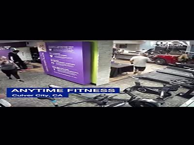  lady runs her SUV through a gym WALL and hitting a guy on a treadmill