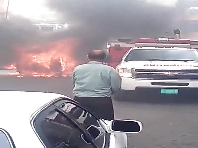 two man burning alive in back of the car