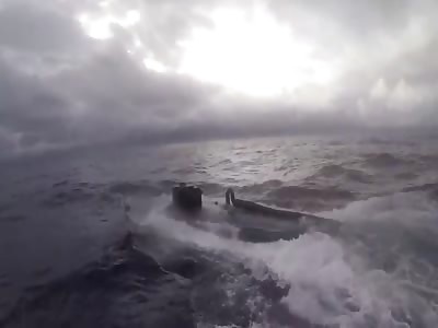U.S. Coast Guardsmen Leap onto Drug Smuggling Submarine. 