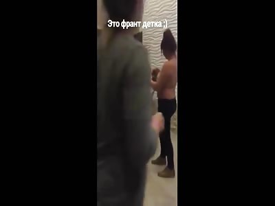 TOPLESS WOMAN USES HER BRA AS A WEAPON