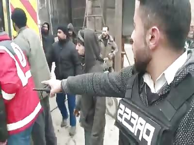 journalist film dead shattered body of young boy in SYRIA