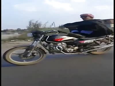 Egyptian asshole riding his motorcycle like a kamel  hit the back of m