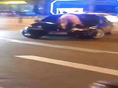 Chinese nude woman gone crazy and jump on cars in street