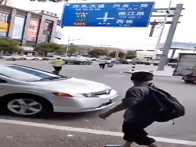 Chinese man on motorcycle run from police gets hit by car