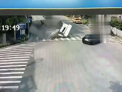Chinese big truck crushed by his own load.