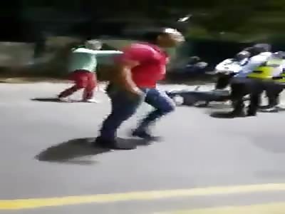 Two Colombian drunk man beating police officers 