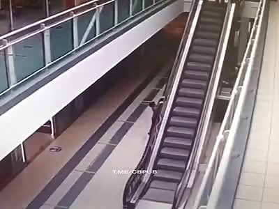 Little boy falls from escalator 