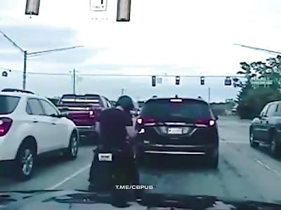 Motorcyclist crushed between two cars 