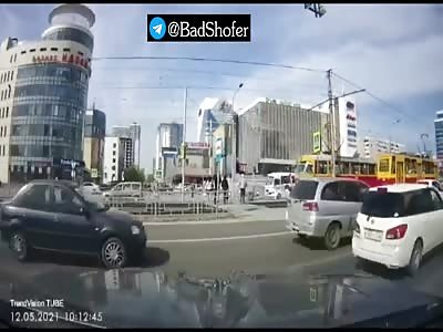 Stupid woman crossing the street hit by speeding car.