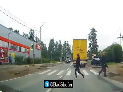 Woman crossing the street is hit by a speeding car. 