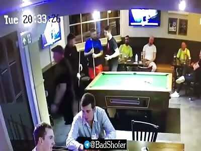 Asshole gets a pool cue to the face.