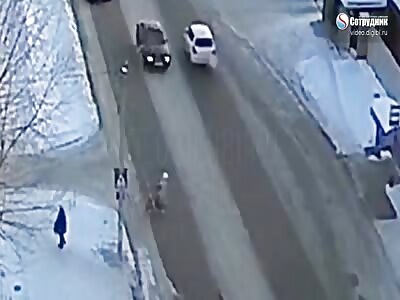 Russian driver crashes into a woman with a child who was crossing road 