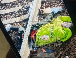 Removing shattred body of young girl committed suicide on train track 